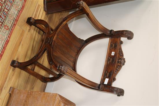 A 19th century carved walnut Savanarola elbow chair W.59cm